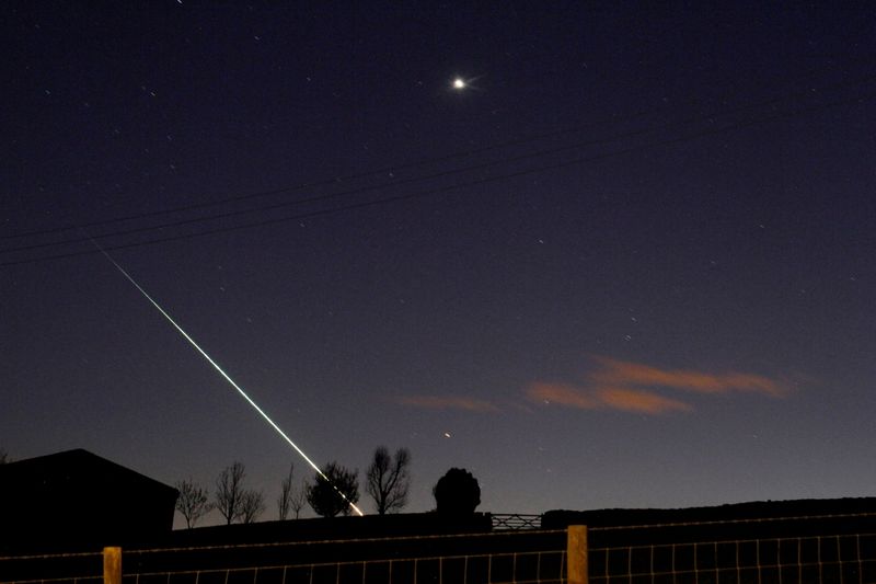 FILE PHOTO: A meteorite creates a streak of light across