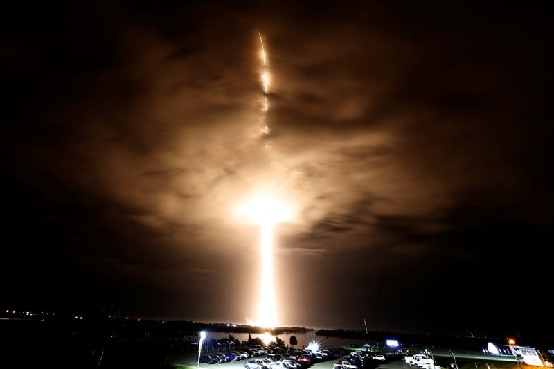 FILE PHOTO: SpaceX Falcon 9 rocket, with the Crew Dragon