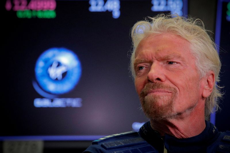 FILE PHOTO: Sir Richard Branson stands on floor of the