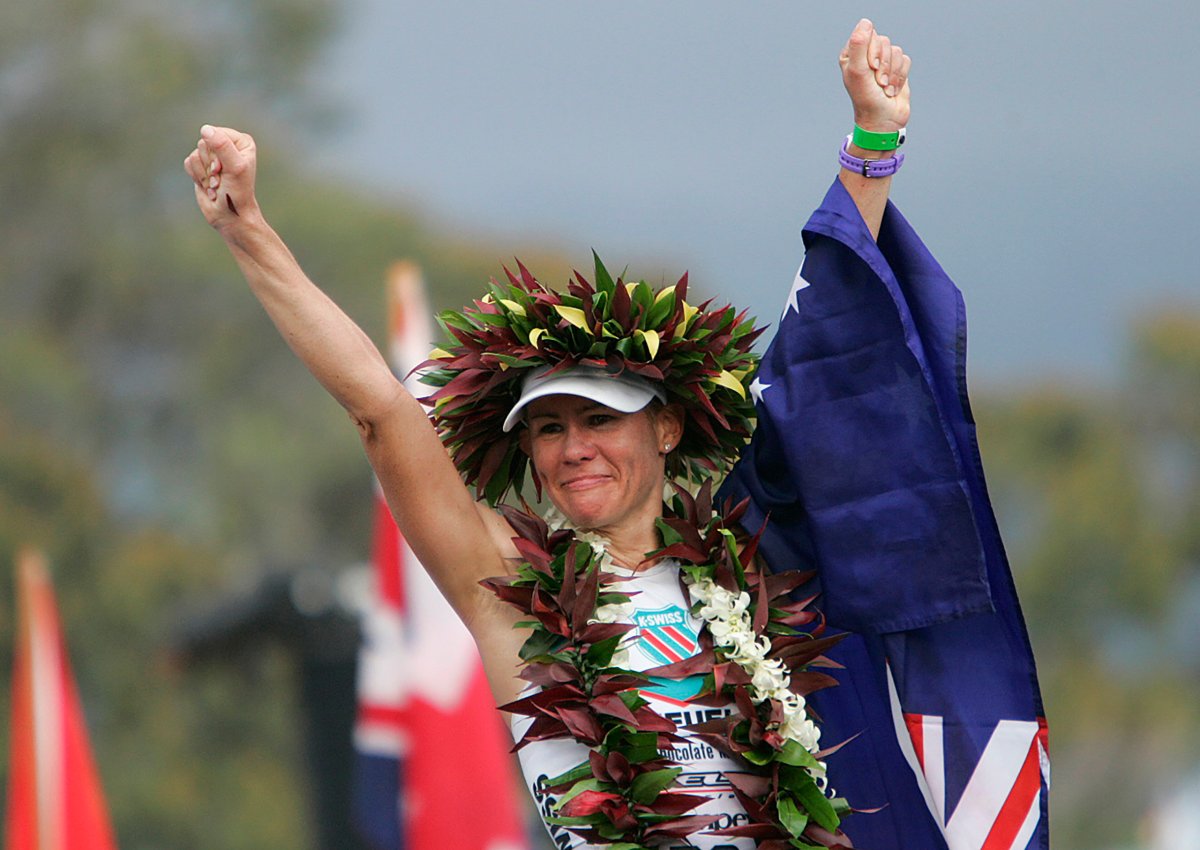 Professional female triathlete Mirinda Carfrae of Australia celebrates after winning