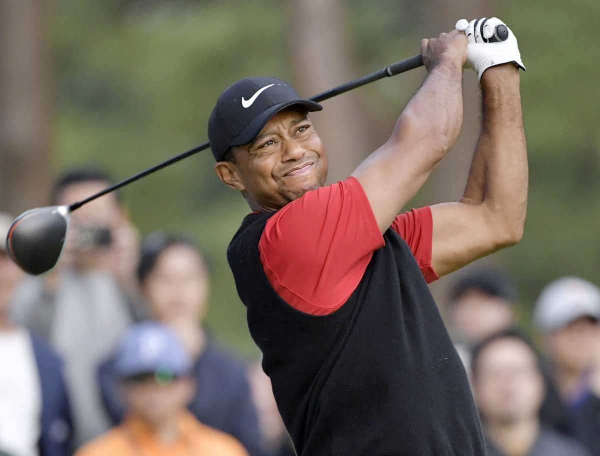 Tiger Woods tees off the 9th hole during the final