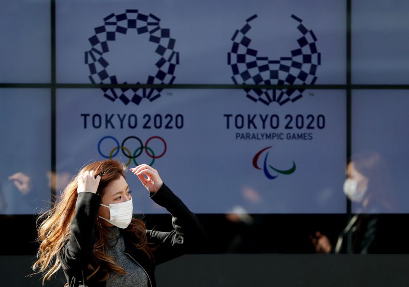 FILE PHOTO: A passerby wearing a protective face mask following