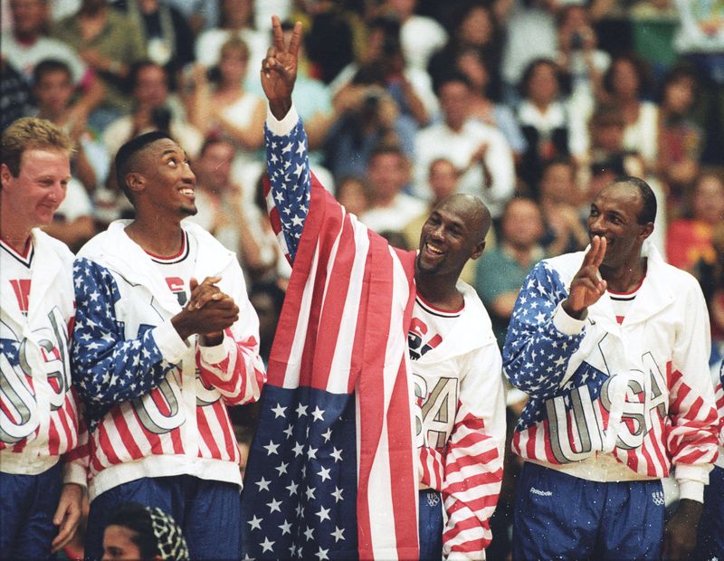 FILE PHOTO: U.S. basketball player Michael Jordan flashes a victory