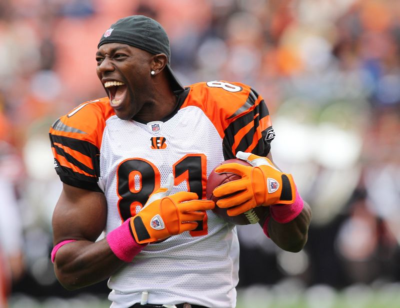 Bengals receiver Owens laughs while warming up prior to his