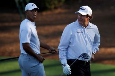 FILE PHOTO: U.S. golfers  Woods and Mickelson walk to