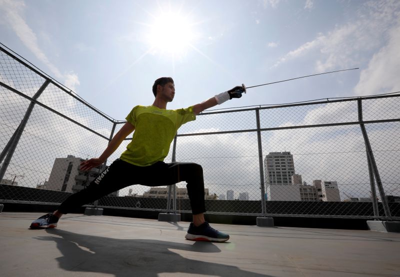 Japan’s Olympic fencing medallist Ryo Miyake trains at the rooftop