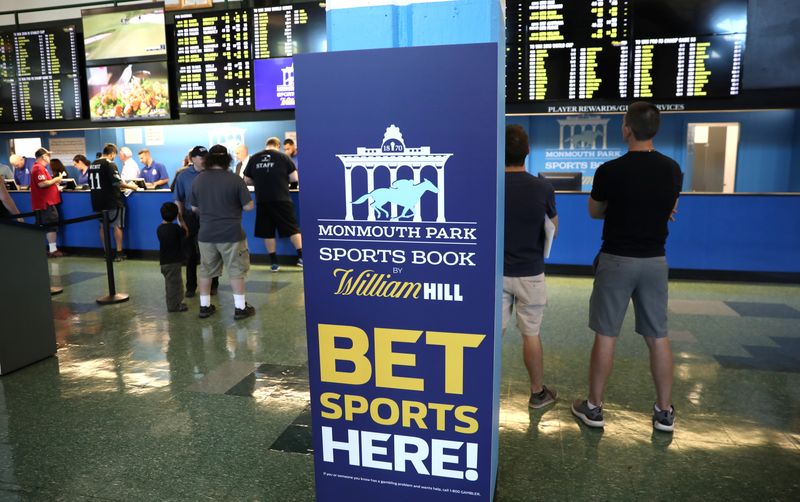 Gamblers place bets on sports at Monmouth Park Sports Book