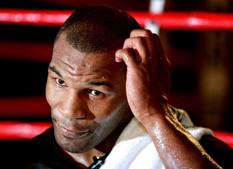 FILE PHOTO: Mike Tyson takes questions during a press conference