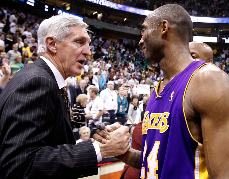 Los Angeles Lakers guard Kobe Bryant shakes hands with Utah