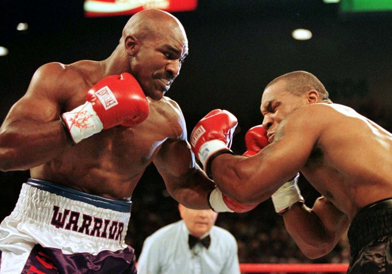 FILE PHOTO: WBA Heavyweight Champion Evander Holyfield (R) connects to