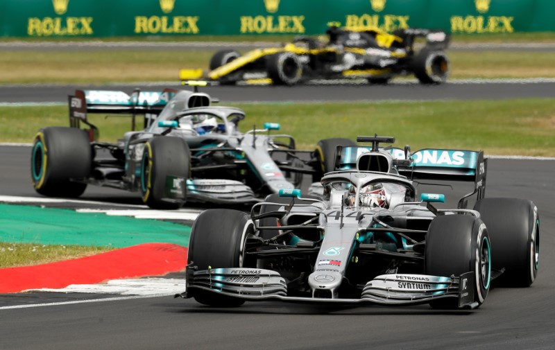 FILE PHOTO: Mercedes’ drivers Lewis Hamilton and Valtteri Bottas in
