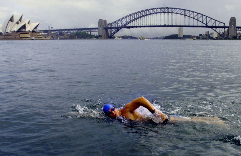FILE PHOTO: Australian swimmer John MacLean trains in Sydney Harbour