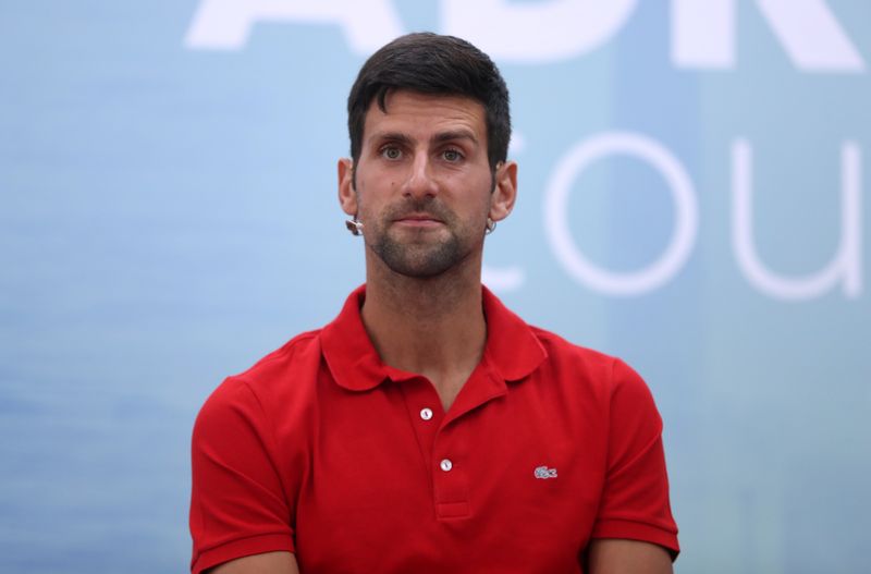 World number one tennis player Novak Djokovic holds a news