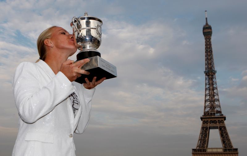 FILE PHOTO: Russia’s Svetlana Kuznetsova kisses her trophy near the