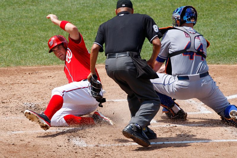 Zimmerman scores ahead of the tag by Mets’ Buck during