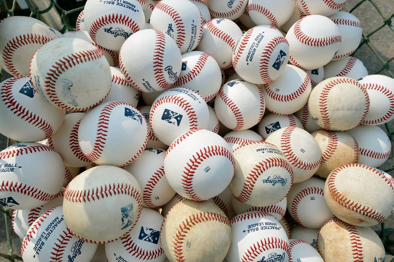 Basket of baseballs are seen during practice at a minor