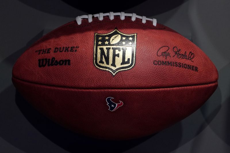 The NFL logo is pictured on a football at an