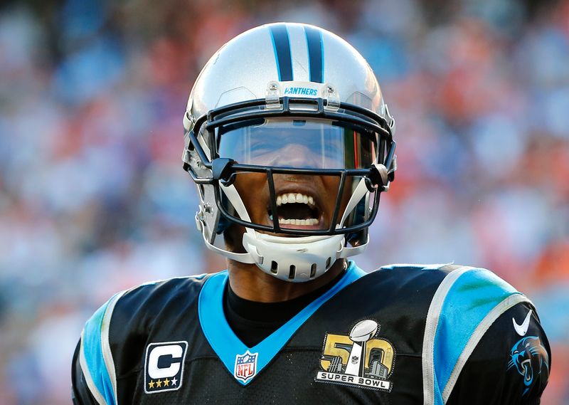 Carolina Panthers’ quarterback Cam Newton celebrates a touchdown against the