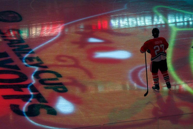 Chicago Blackhawks defenseman Oduya stands in the middle of his