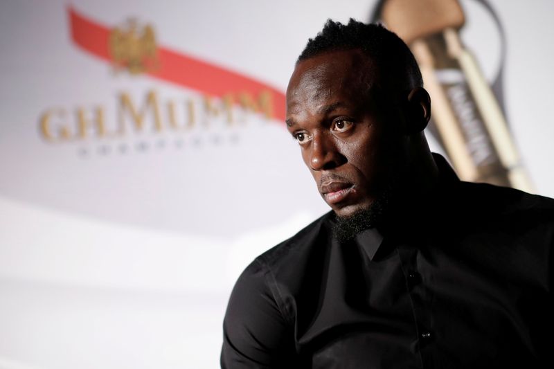 FILE PHOTO: Retired sprinter Usain Bolt attends a news conference
