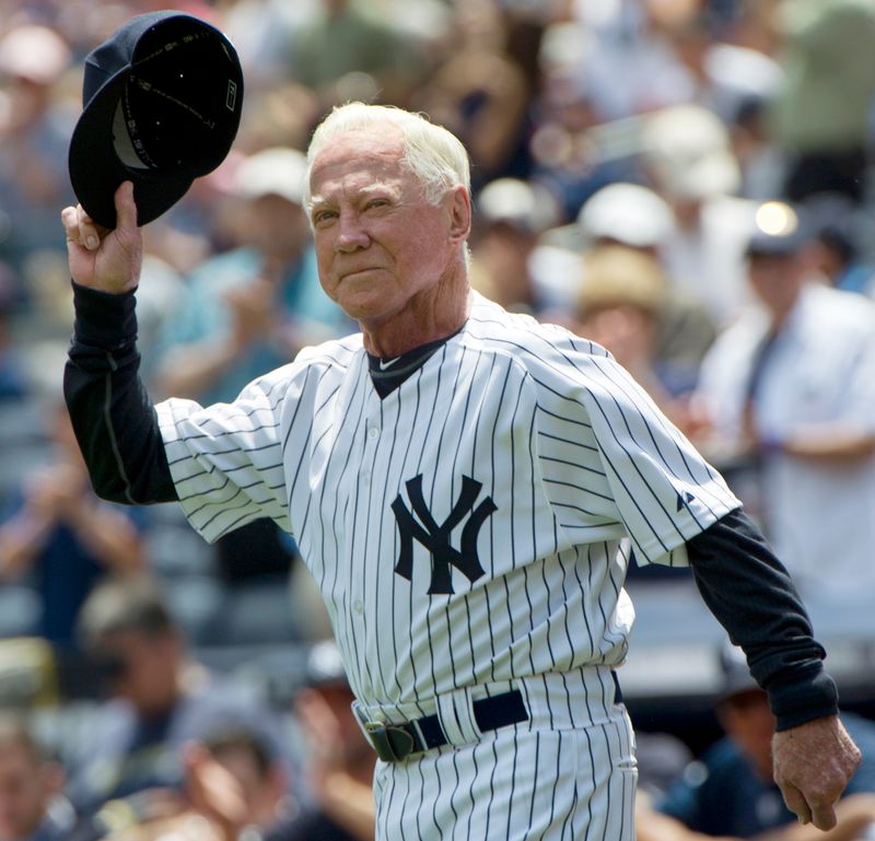 Hall of Famer Whitey Ford tips his cap as he