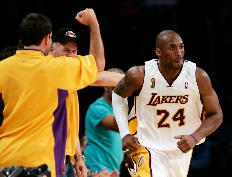 FILE PHOTO:  Fans cheer after Lakers Kobe Bryant hit