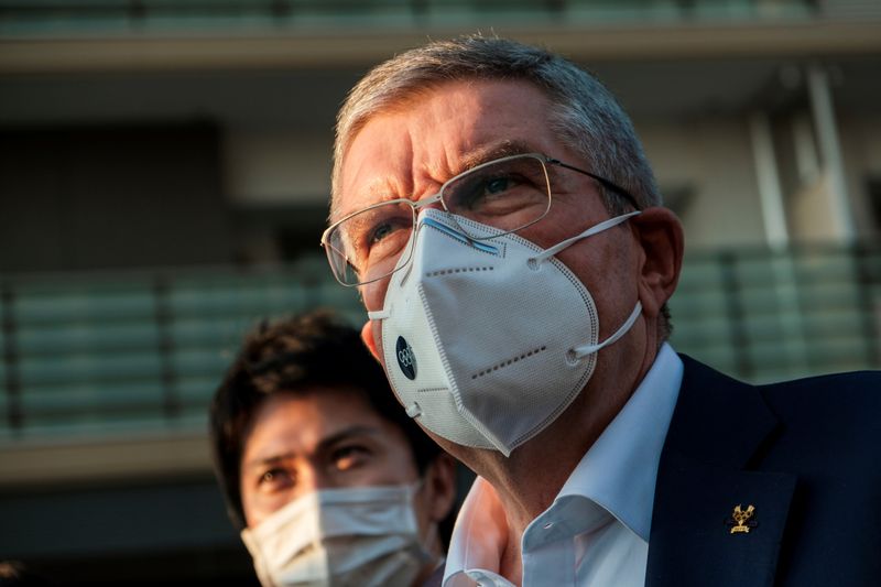 Thomas Bach, International Olympic Committee (IOC) President wearing a protective