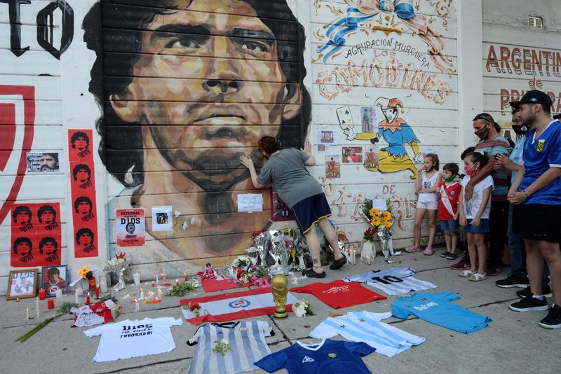 Fans gather to mourn the death of soccer legend Diego