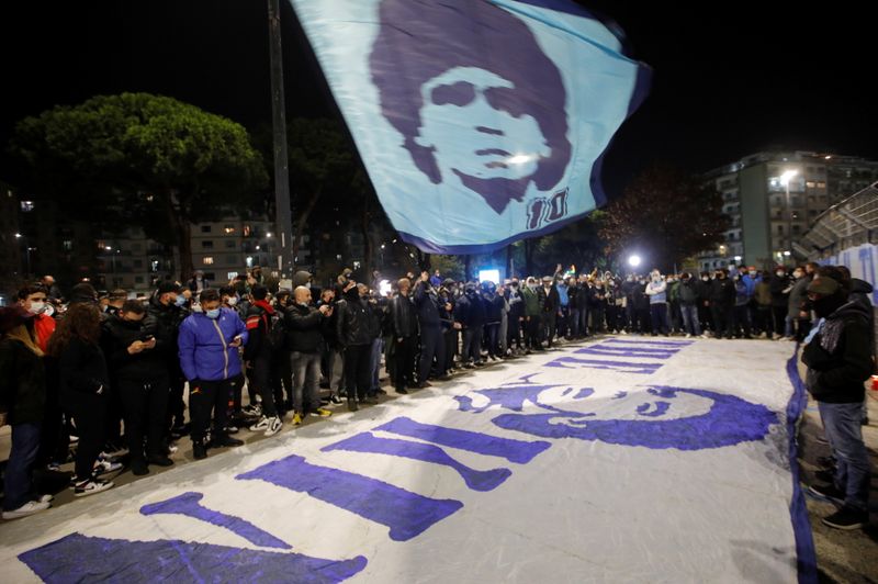 People gather to mourn the death of Argentine soccer legend