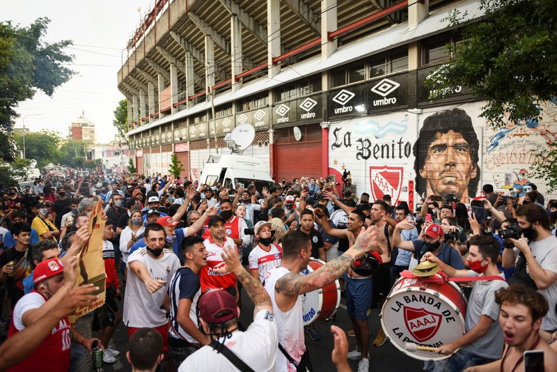 People gather to mourn the death of soccer legend Diego