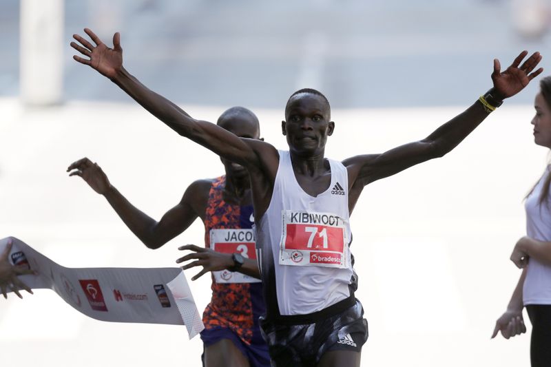Kibiwott Kandie of Kenya crosses the finish line to win