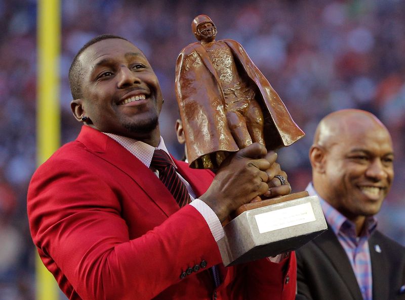 Carolina Panthers linebacker Thomas Davis is honored with the 2014
