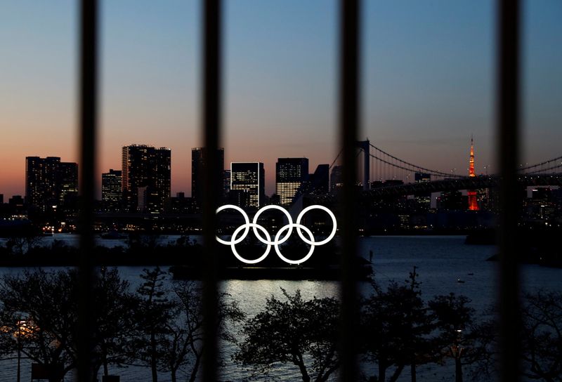 FILE PHOTO: The Olympic rings are pictured at dusk through