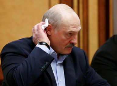 FILE PHOTO: Belarusian President Alexander Lukashenko listens to Russian President