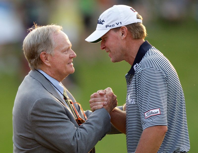 FILE PHOTO: Steve Stricker of the U.S. shakes hands with