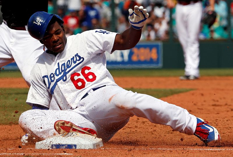 FILE PHOTO: Los Angeles Dodgers’ Puig reacts after being tagged