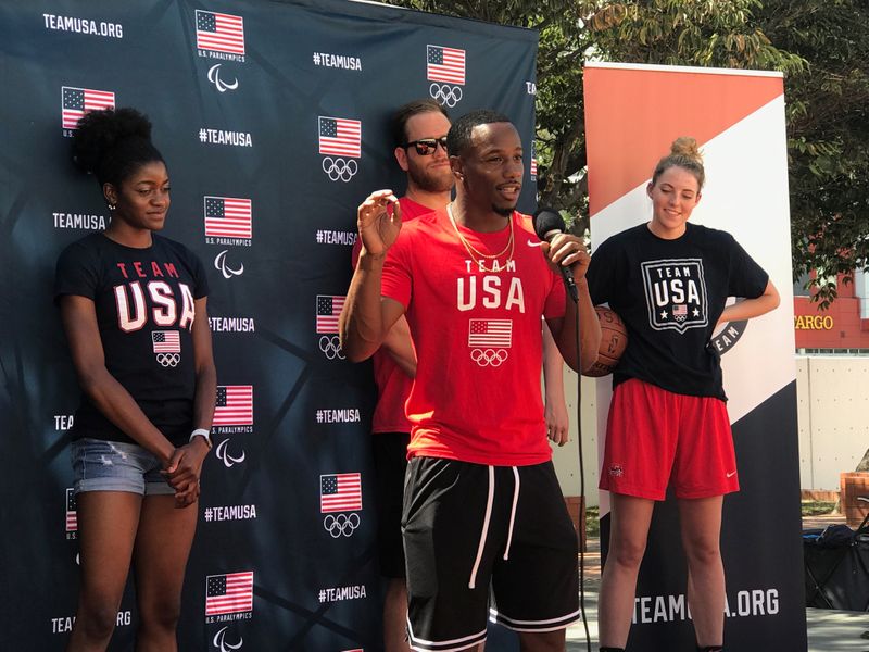 FILE PHOTO: Team USA Rugby wing Carlin Isles is flanked