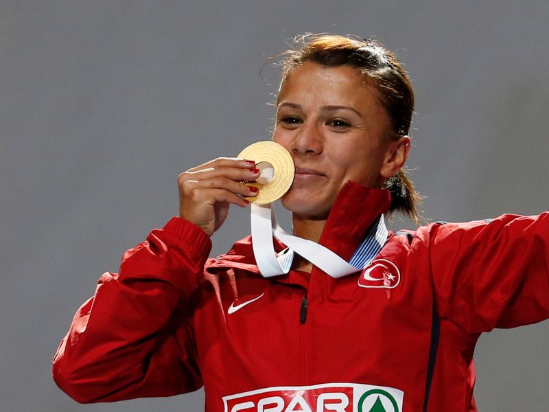 Mingir of Turkey poses with her gold medal after the