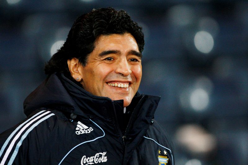 FILE PHOTO: Argentina’s soccer team head coach Maradona smiles during