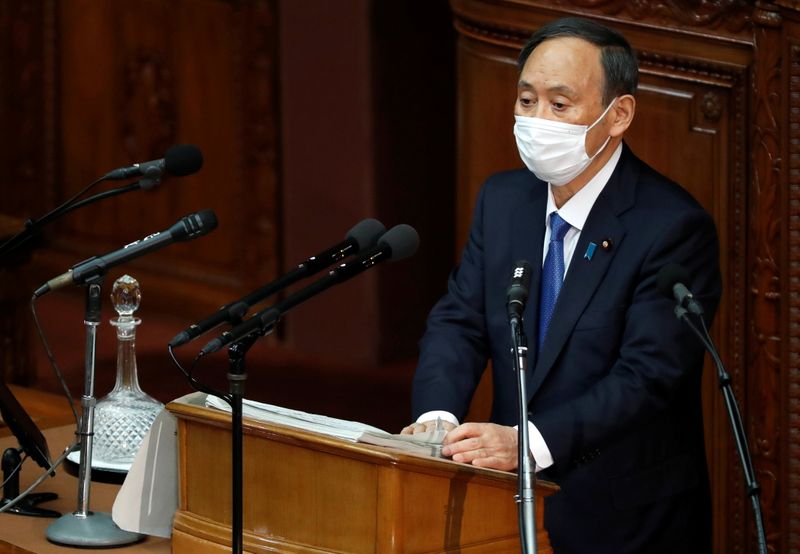 Japan’s Prime Minister Yoshihide Suga delivers his policy speech at