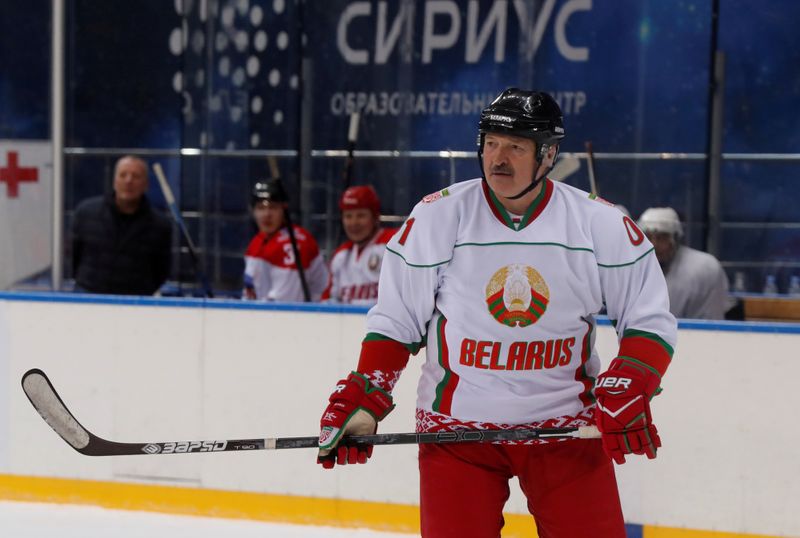 FILE PHOTO: Belarusian President Alexander Lukashenko plays ice hockey