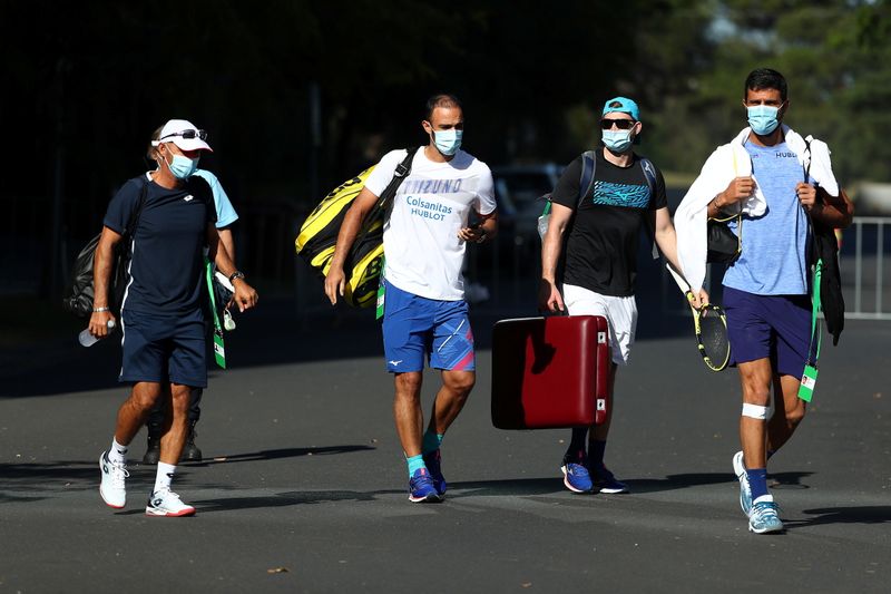 Tennis players in quarantine are escorted to training facilities in