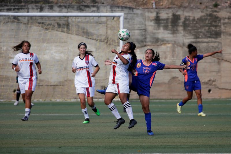 Deportivo Petare Futbol Club’s player Mariannys Rodriguez heads the ball