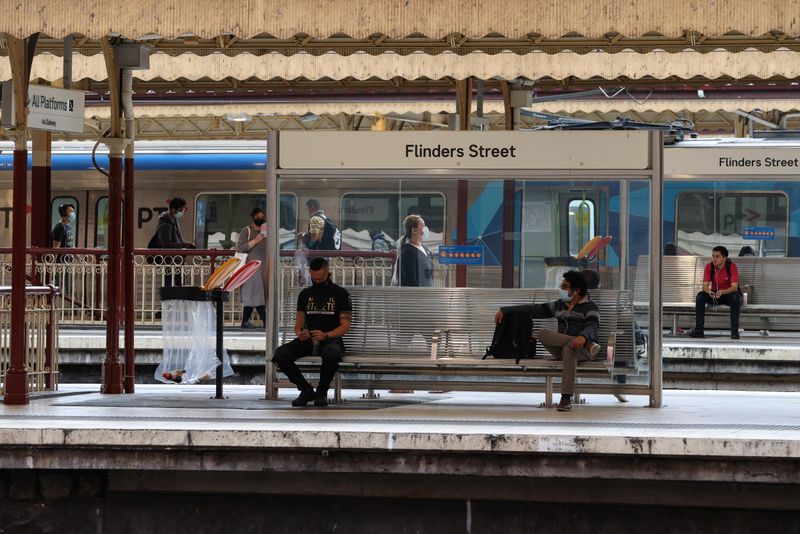 People wait for trains at Flinders Street Station in Melbourne
