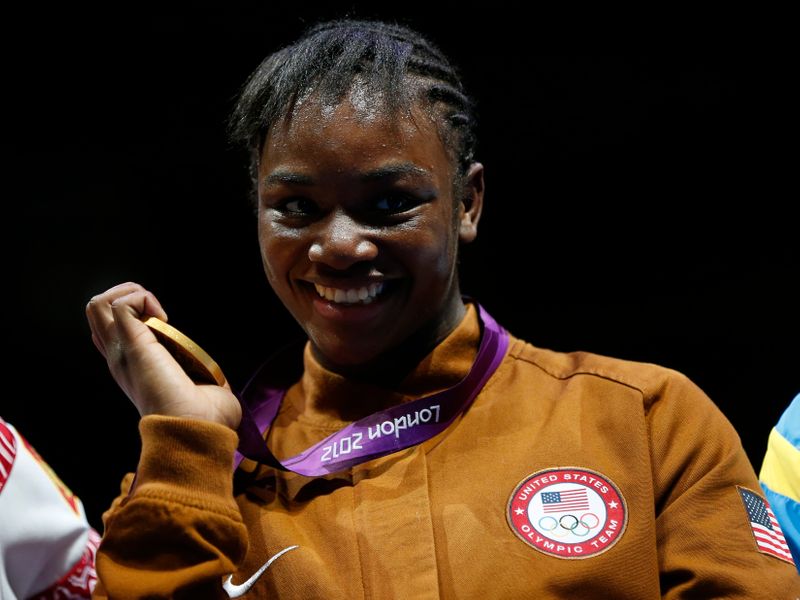 Claressa Shields of the U.S. stands with her gold medal