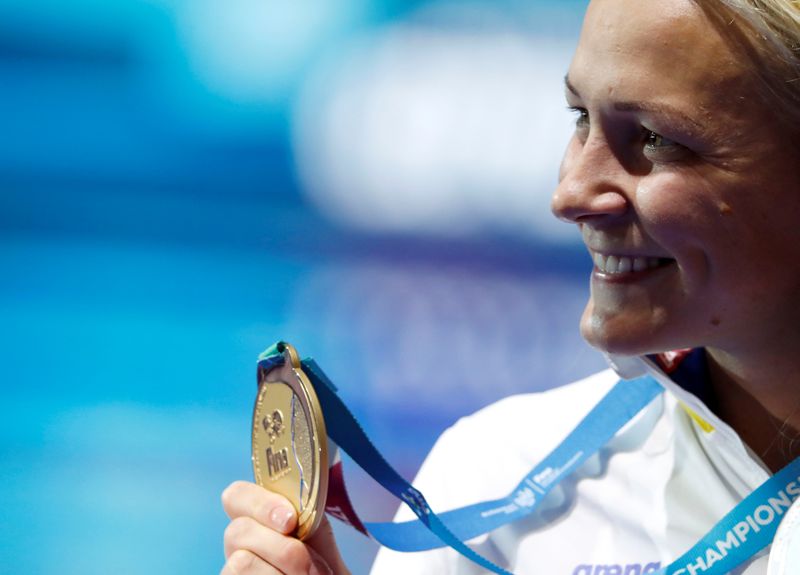 FILE PHOTO: Sarah Sjostrom of Sweden poses with her gold