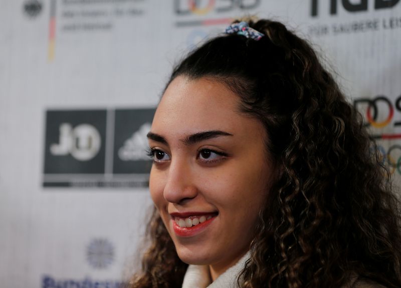 Iran’s only female Olympic medallist Kimia Alizadeh holds a press