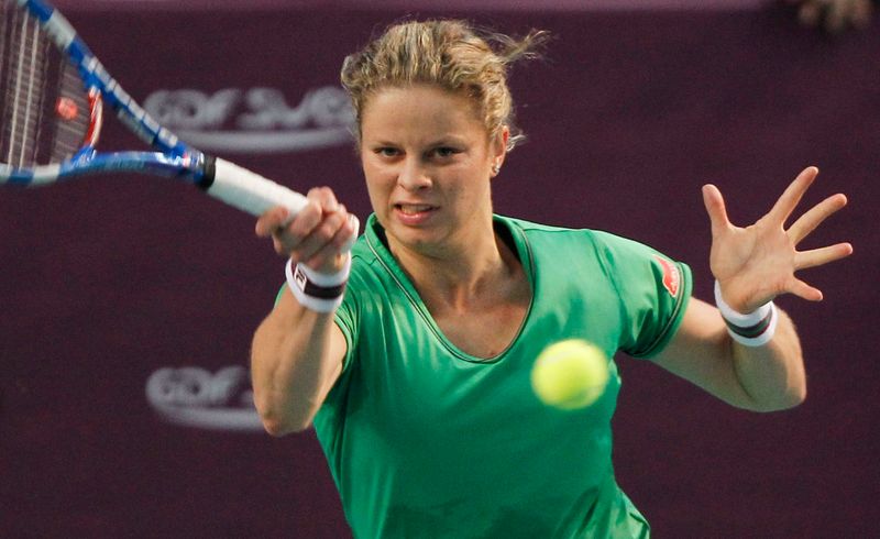 Kim Clijsters of Belgium returns a shot to Jelena Dokic