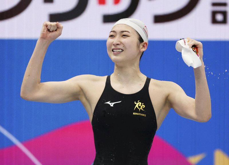 Rikako Ikee of Japan reacts after winning the women’s 100-meter