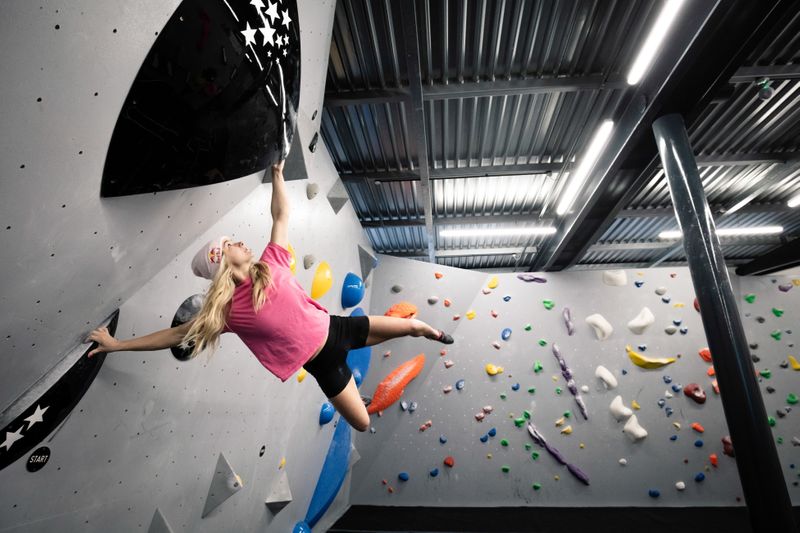 Shauna Coxsey climbs a boulder problem at The Climbing Hangar